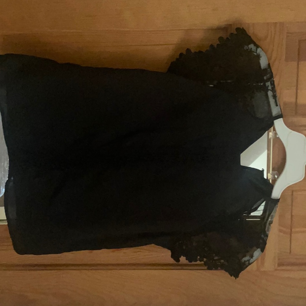 Black blouse with lace details and lace capped sleeves